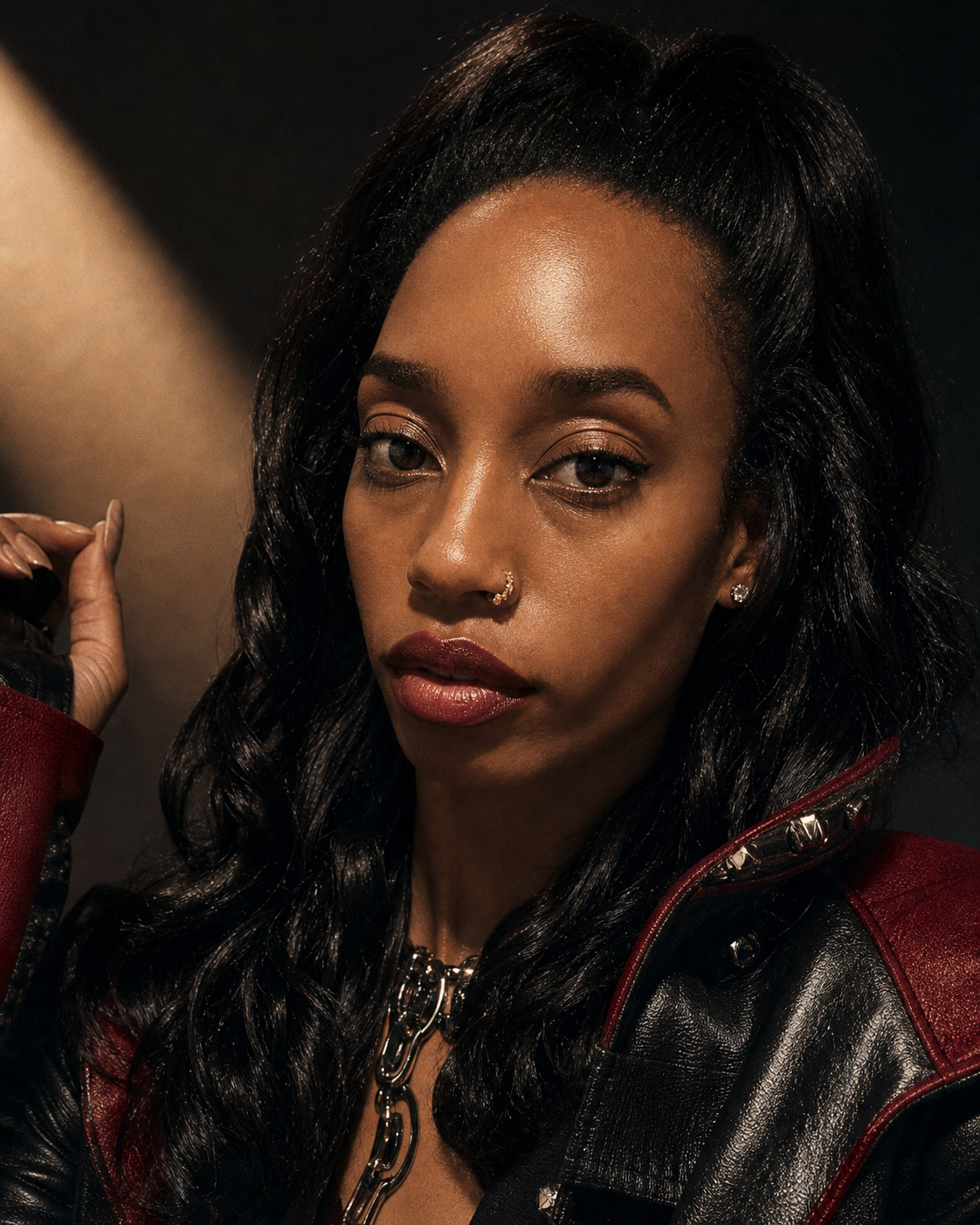 Illumi Beauty model in a black and red leather editorial look